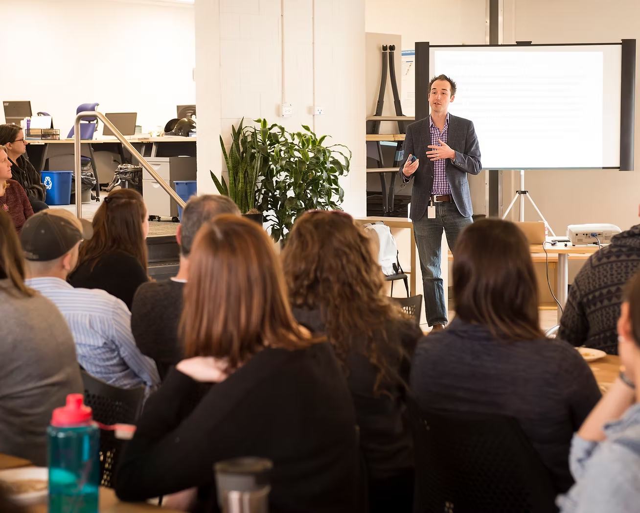Paul Wicks delivering a talk to a seated audience